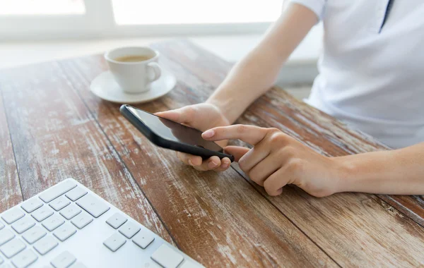 Close up of hands with smart phone at office table — 图库照片