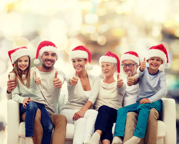 Happy family sitting on couch — Stock Photo, Image