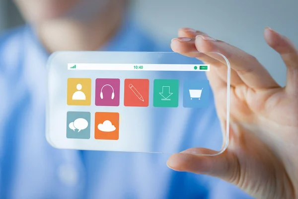 Close up of woman with transparent smartphone — Stock Photo, Image