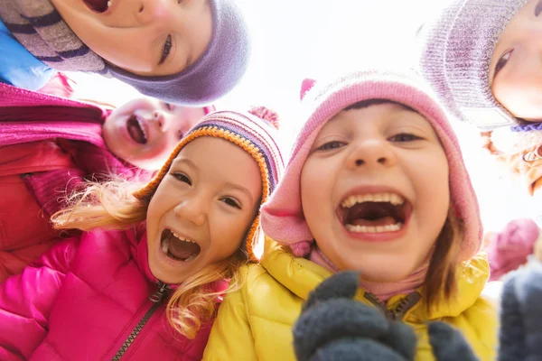 Group of happy children faces in circle — Stock Photo, Image