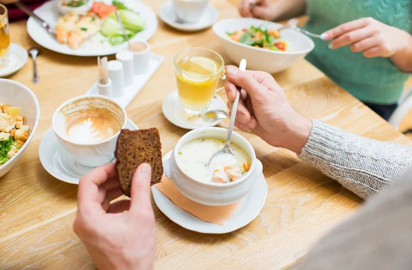 Close up man eating soup for dinner at restaurant — Stock Image Close up man eating soup for dinner at restaurant Stock Image