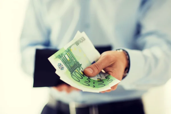 Close up of businessman hands holding money — Stock Photo, Image