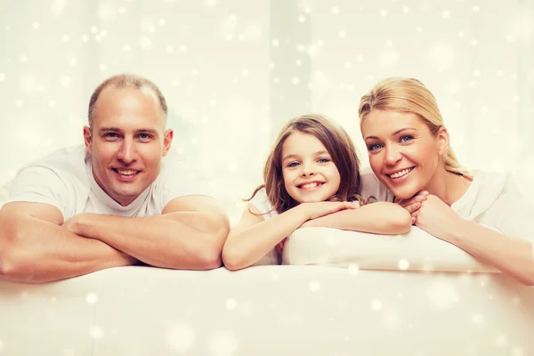 Smiling parents and little girl at home — Stock Photo, Image