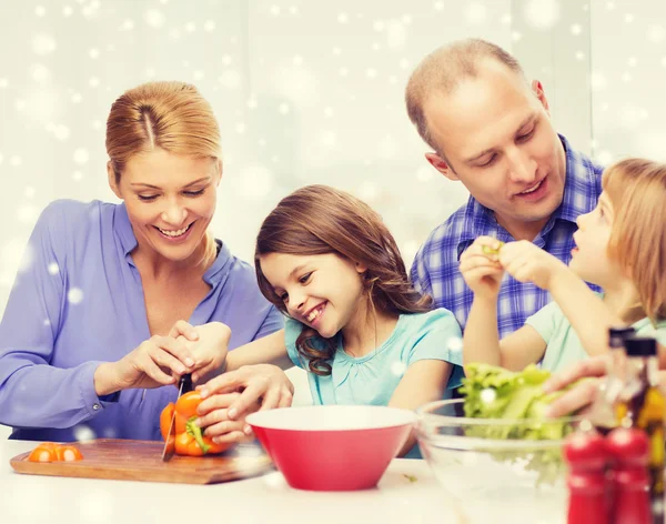 Happy family with two kids making dinner at home — Stock Photo, Image