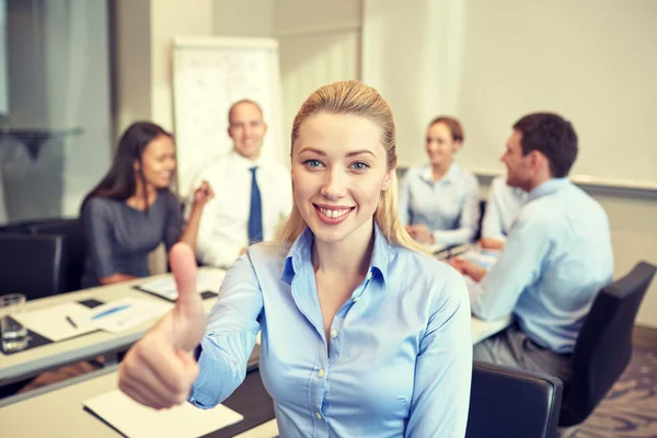 Group of smiling businesspeople meeting in office — Stock Photo, Image