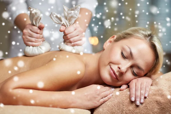 Close up of woman having herbal bag massage in spa — Stock Photo, Image