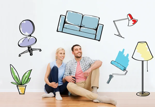 Happy couple of man and woman moving to new home — Stock Photo, Image