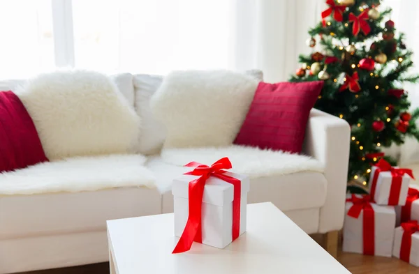 Close up of christmas gift box on table at home — Stock Photo, Image