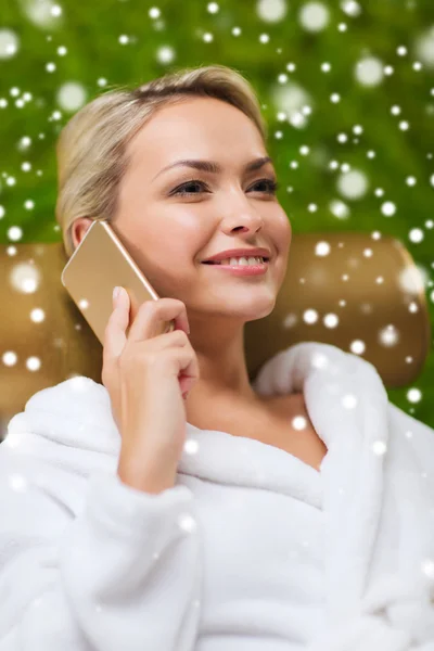 Beautiful young woman with smartphone at spa — Stock Photo, Image