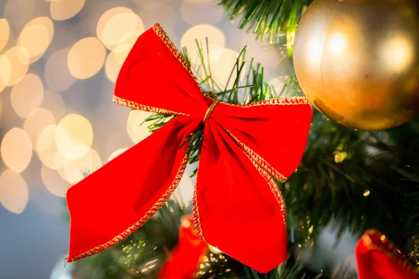 Close up of red bow decoration on christmas tree — Stock Photo, Image