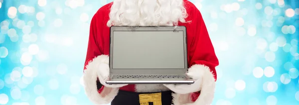 Close-up van de kerstman met laptop — Stockfoto