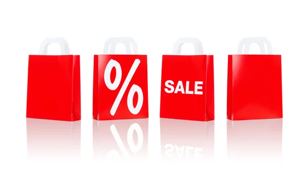 Many red shopping bags with sale and percentage — Stock Fotó