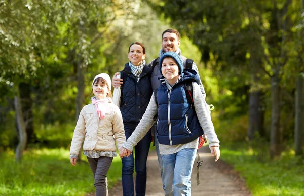 Happy family with backpacks hiking — Stock Photo, Image