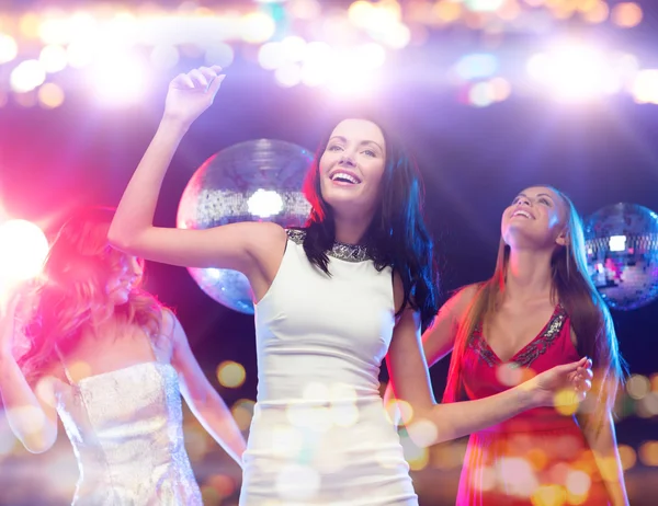 Happy women dancing at night club — Stok fotoğraf