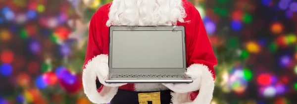 Close-up van de kerstman met laptop — Stockfoto