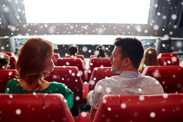 Happy friends or couple watching movie in theater — Stockfoto