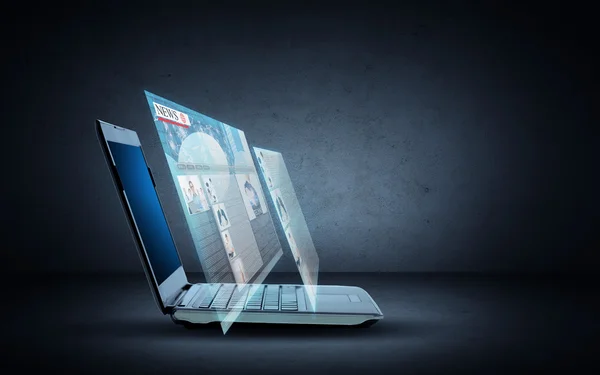 Laptop computer with news web page projection — Stock Photo, Image