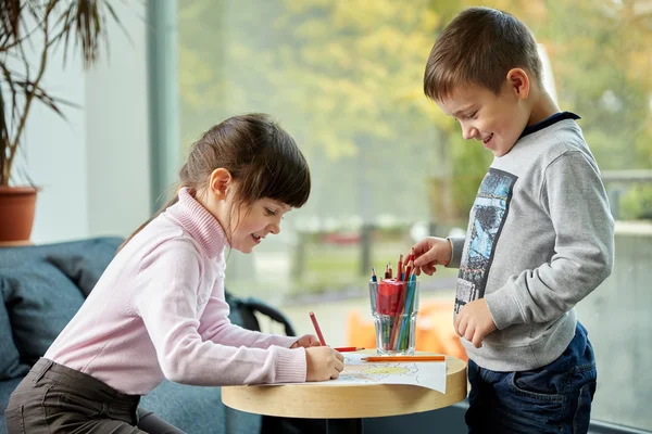 Happy little girl and boy drawing at home — Stock Photo, Image