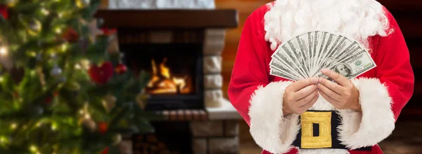 Close-up van de kerstman met dollar geld — Stockfoto