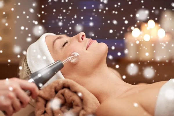 Close up of young woman having face massage in spa — Stock Photo, Image