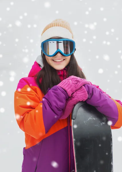 Happy young woman with snowboard outdoors — Stock Photo, Image