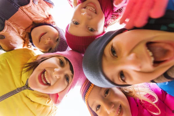 Group of happy children faces in circle — Stock Photo, Image