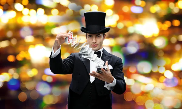 Magician showing trick with playing cards — Stock Photo, Image