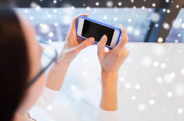 Close up of woman with smartphone at office — Stock Photo, Image