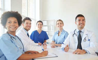 group of happy doctors meeting at hospital office clipart