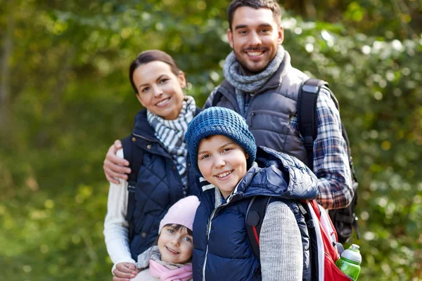 Happy family with backpacks hiking — Stock Photo, Image