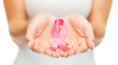 hands holding pink breast cancer awareness ribbon clipart