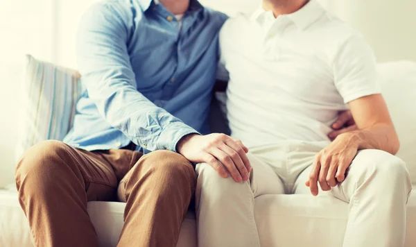 Close up of happy male gay couple hugging at home — Stock Photo, Image