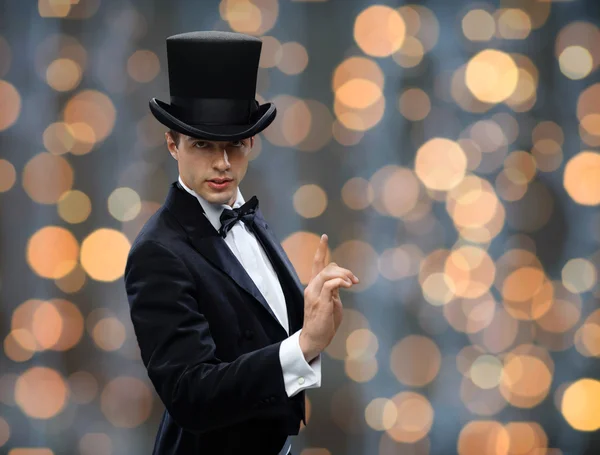 Magician in top hat pointing finger up — Stok fotoğraf