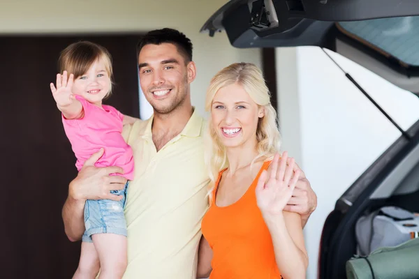 Happy family with hatchback car at home parking — Stock Photo, Image