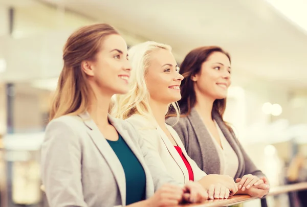 Happy young women in mall or business center — Stock Photo, Image