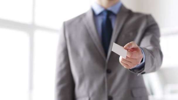 Close up of businessman giving white blank card — Stock Video