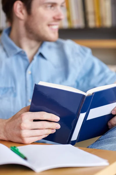 Close up of student reading book at school — Stock Photo, Image