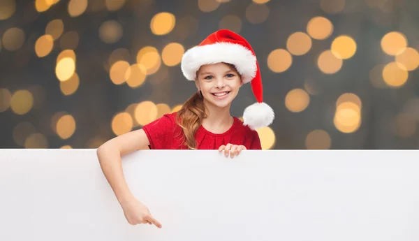Kind mit Weihnachtsmann-Helfermütze mit weißem Brett — Stockfoto