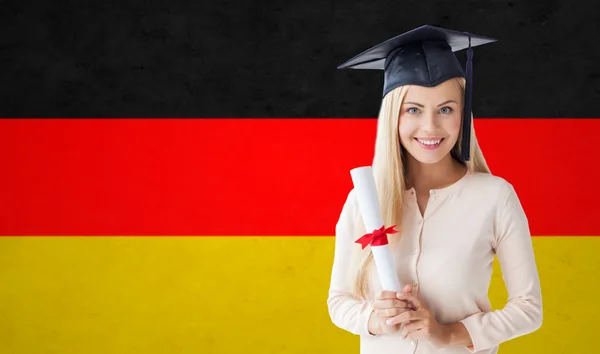 Happy student girl in bachelor cap with diploma — Stock Photo, Image