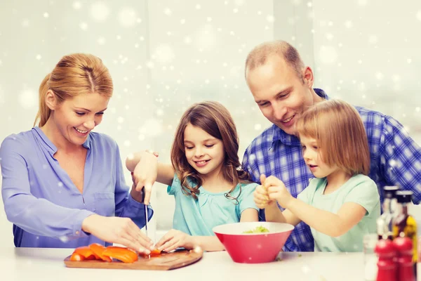 Happy family with two kids making dinner at home — Stock Photo, Image