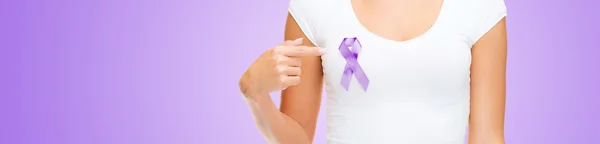 Close up of woman with purple awareness ribbon — 图库照片