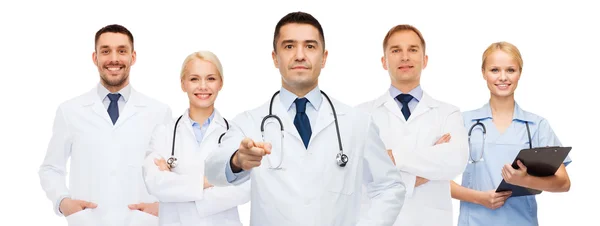 Group of doctors with clipboard pointing at you — Stok fotoğraf