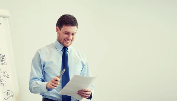 Smiling businessman on presentation in office — Stock Photo, Image