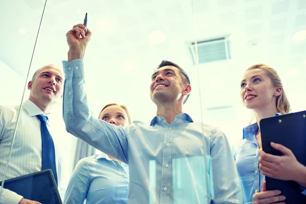 Smiling business people with marker and stickers — Stock Photo, Image