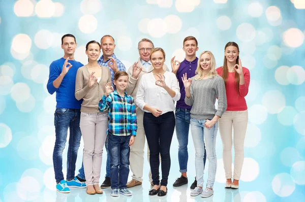 Group of happy people showing ok hand sign — Stockfoto
