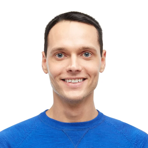 Lächelnder junger Mann im blauen Pullover-Porträt — Stockfoto