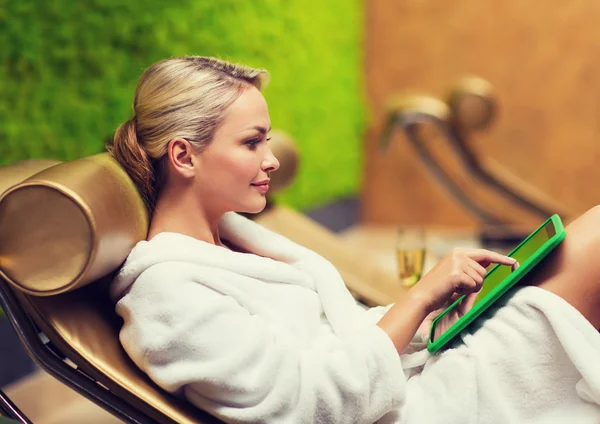 Beautiful young woman with smartphone at spa — Stock Photo, Image