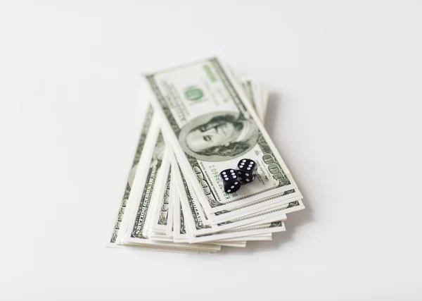 Close up of black dice and dollar cash money — Stock Photo, Image