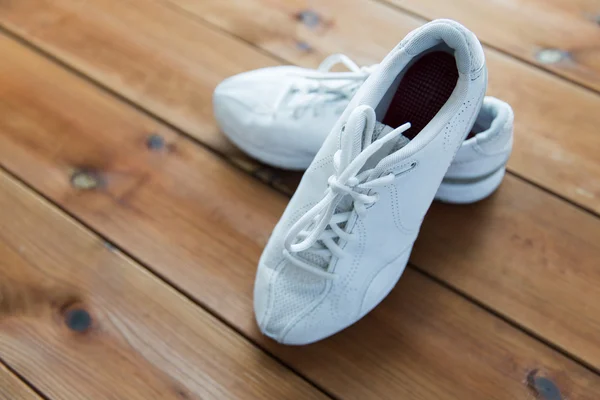 Close up of sneakers on wooden floor — Stock Photo, Image
