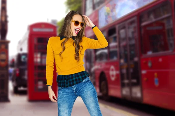 Happy young woman or teen over london city street — Stockfoto